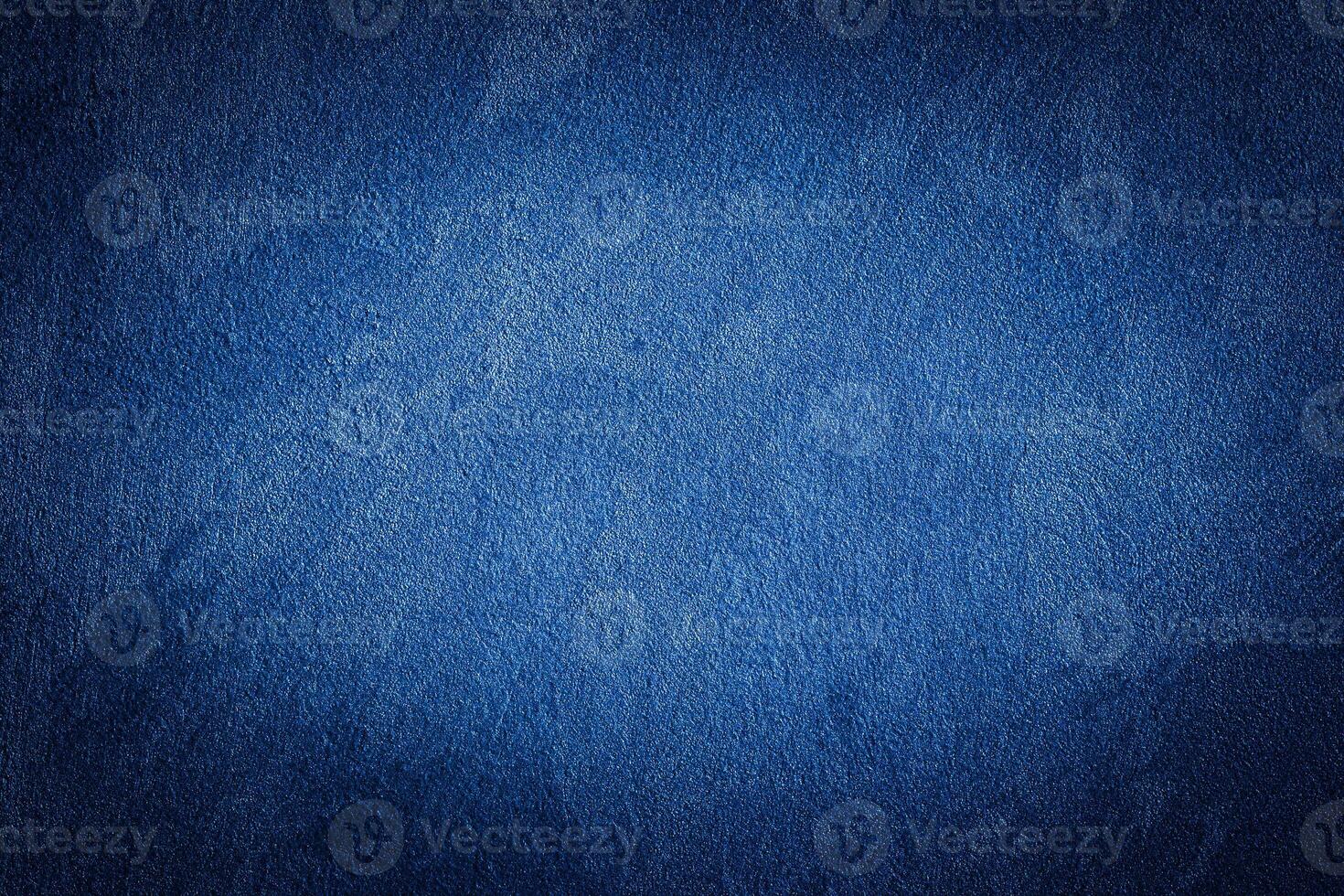 Blue decorative plaster texture with vignette. Abstract grunge background with copy space. photo