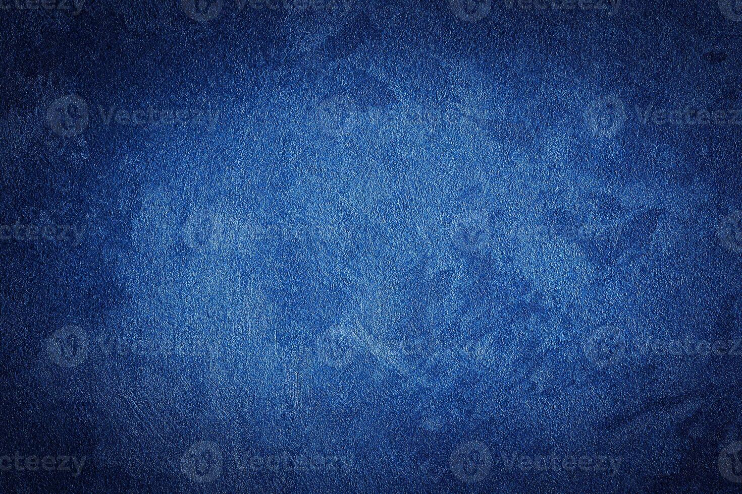 Blue decorative plaster texture with vignette. Abstract grunge background with copy space. photo