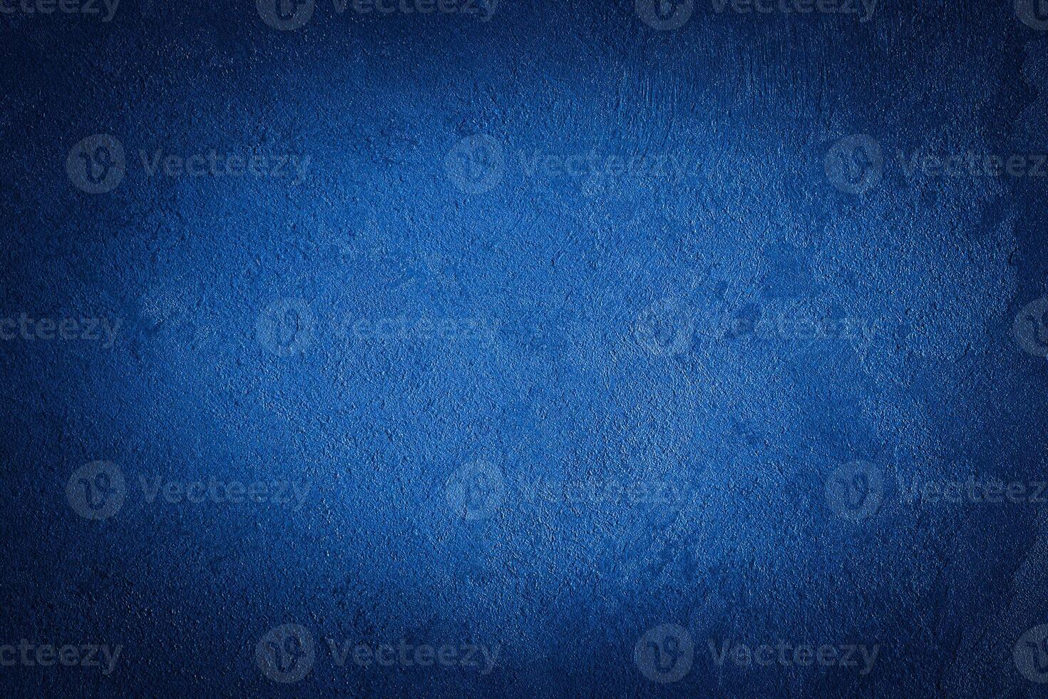 Blue decorative plaster texture with vignette. Abstract grunge background with copy space. photo