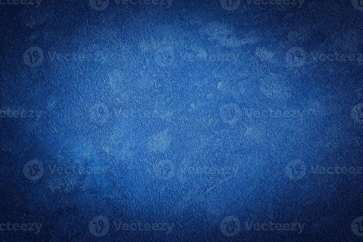 Blue decorative plaster texture with vignette. Abstract grunge background with copy space. photo