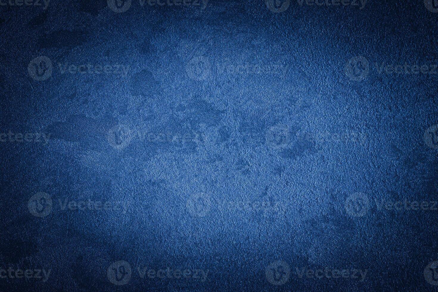 Blue decorative plaster texture with vignette. Abstract grunge background with copy space. photo