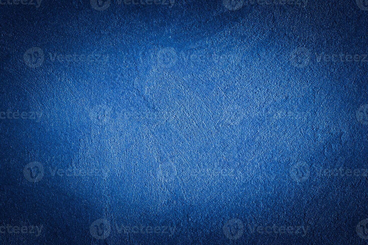 Blue decorative plaster texture with vignette. Abstract grunge background with copy space. photo