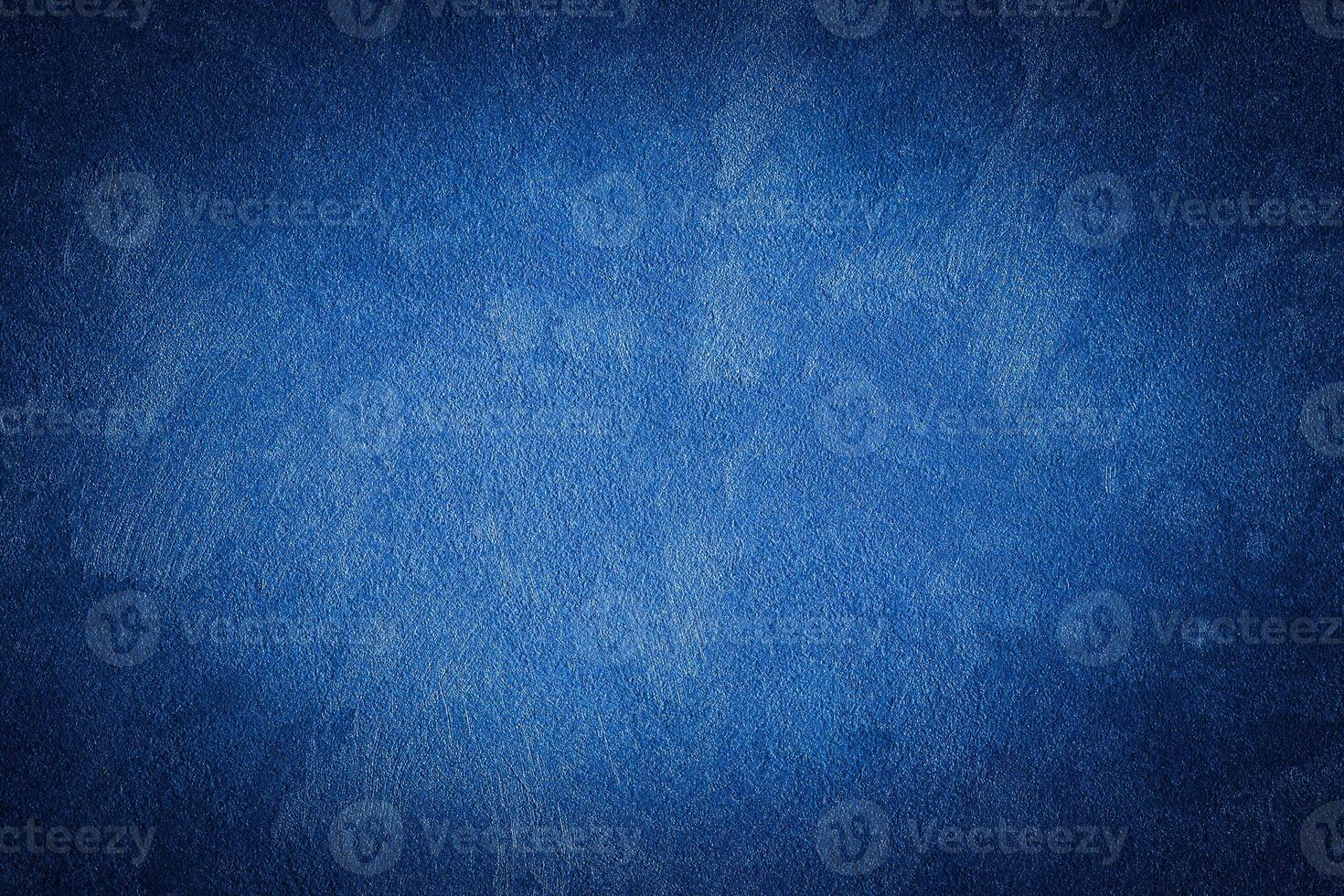 Blue decorative plaster texture with vignette. Abstract grunge background with copy space. photo