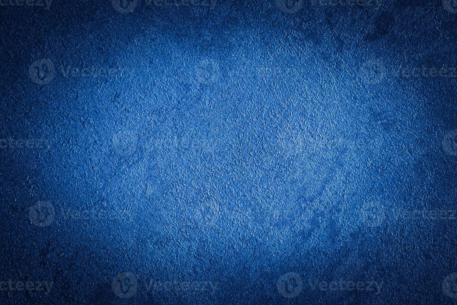 Blue decorative plaster texture with vignette. Abstract grunge background with copy space. photo