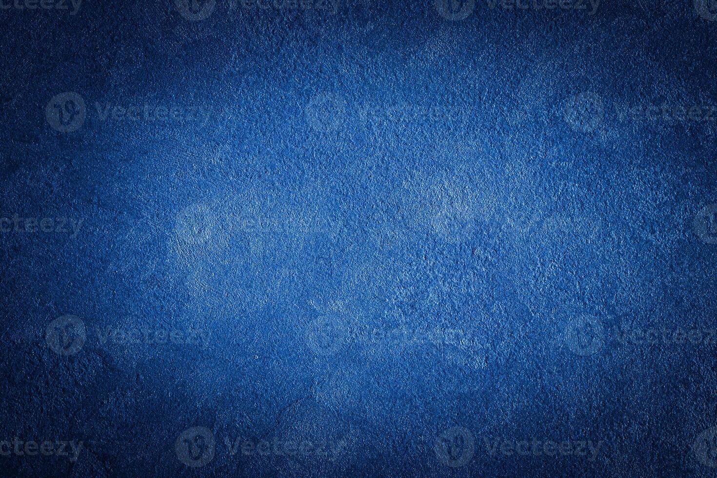 Blue decorative plaster texture with vignette. Abstract grunge background with copy space. photo