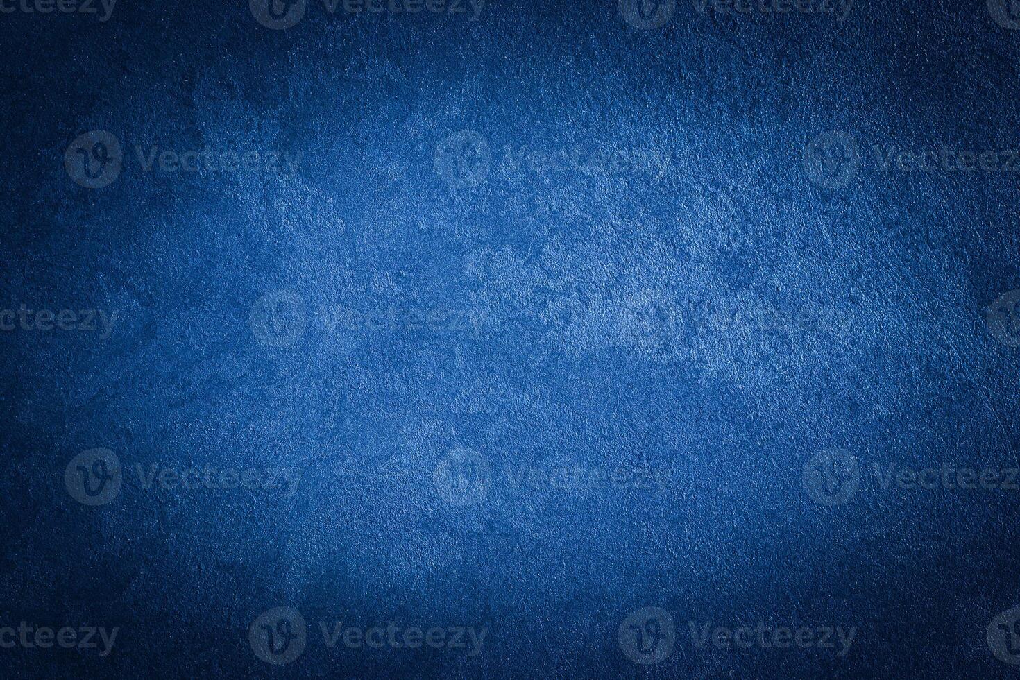 Blue decorative plaster texture with vignette. Abstract grunge background with copy space. photo