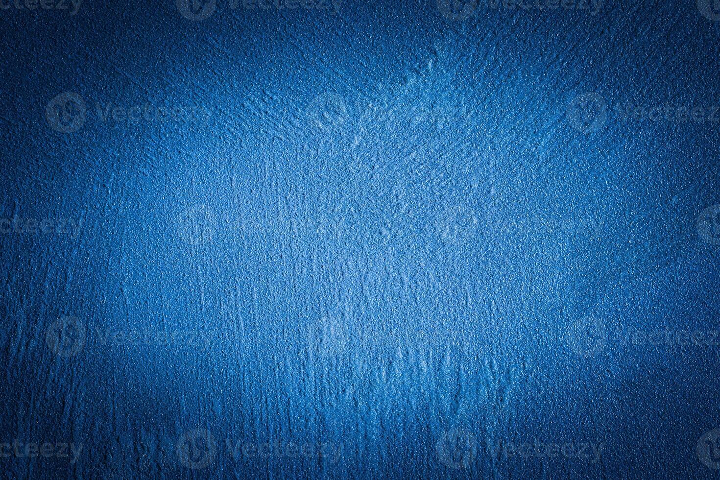 Blue decorative plaster texture with vignette. Abstract grunge background with copy space. photo