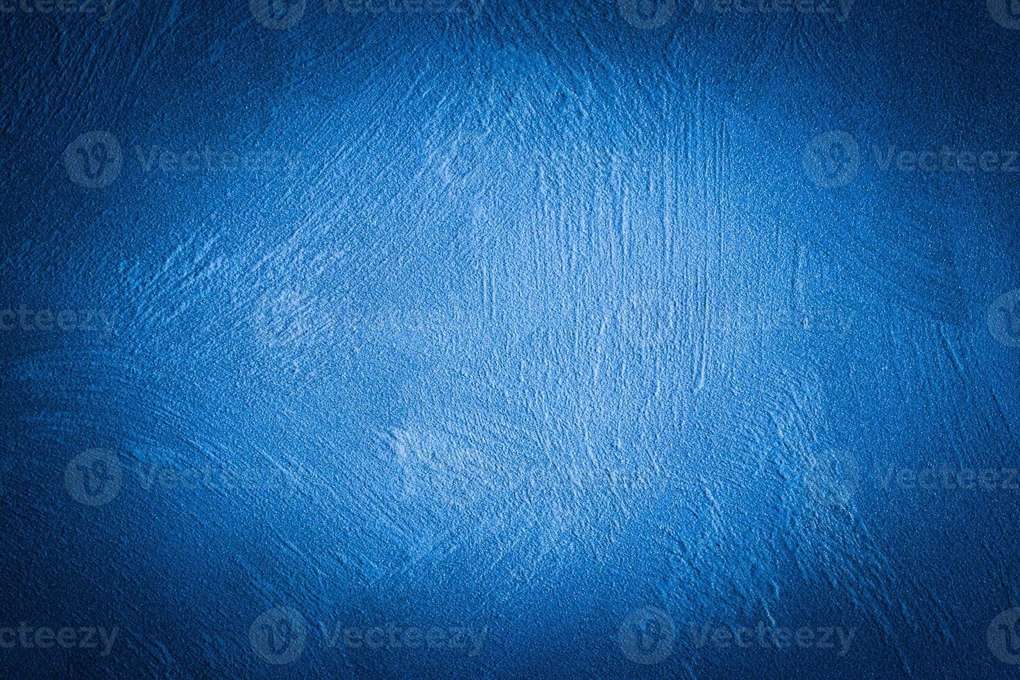 Blue decorative plaster texture with vignette. Abstract grunge background with copy space. photo