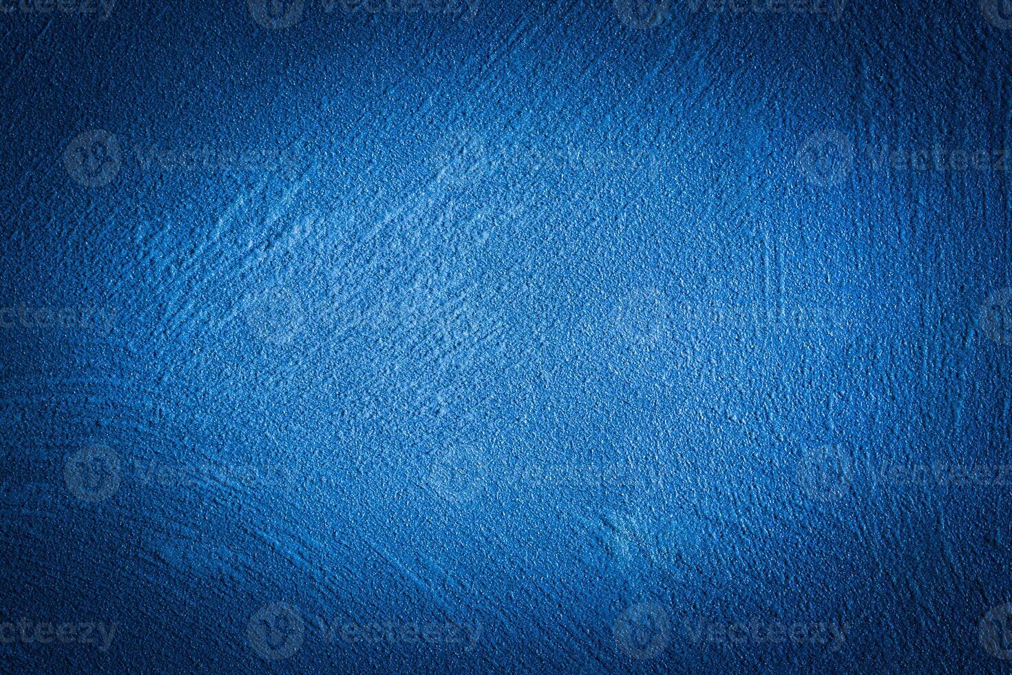 Blue decorative plaster texture with vignette. Abstract grunge background with copy space. photo