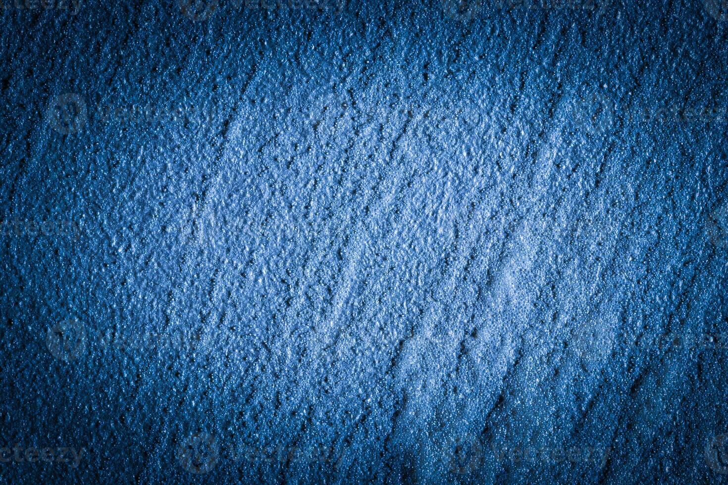 Blue decorative plaster texture with vignette. Abstract grunge background with copy space. photo