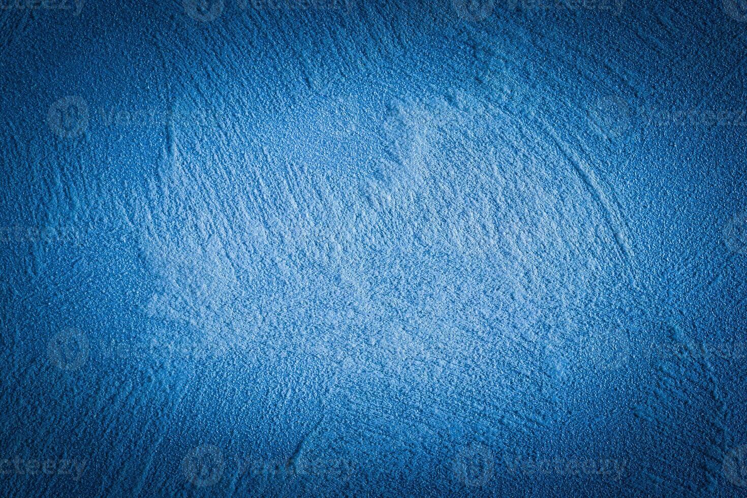 Blue decorative plaster texture with vignette. Abstract grunge background with copy space. photo