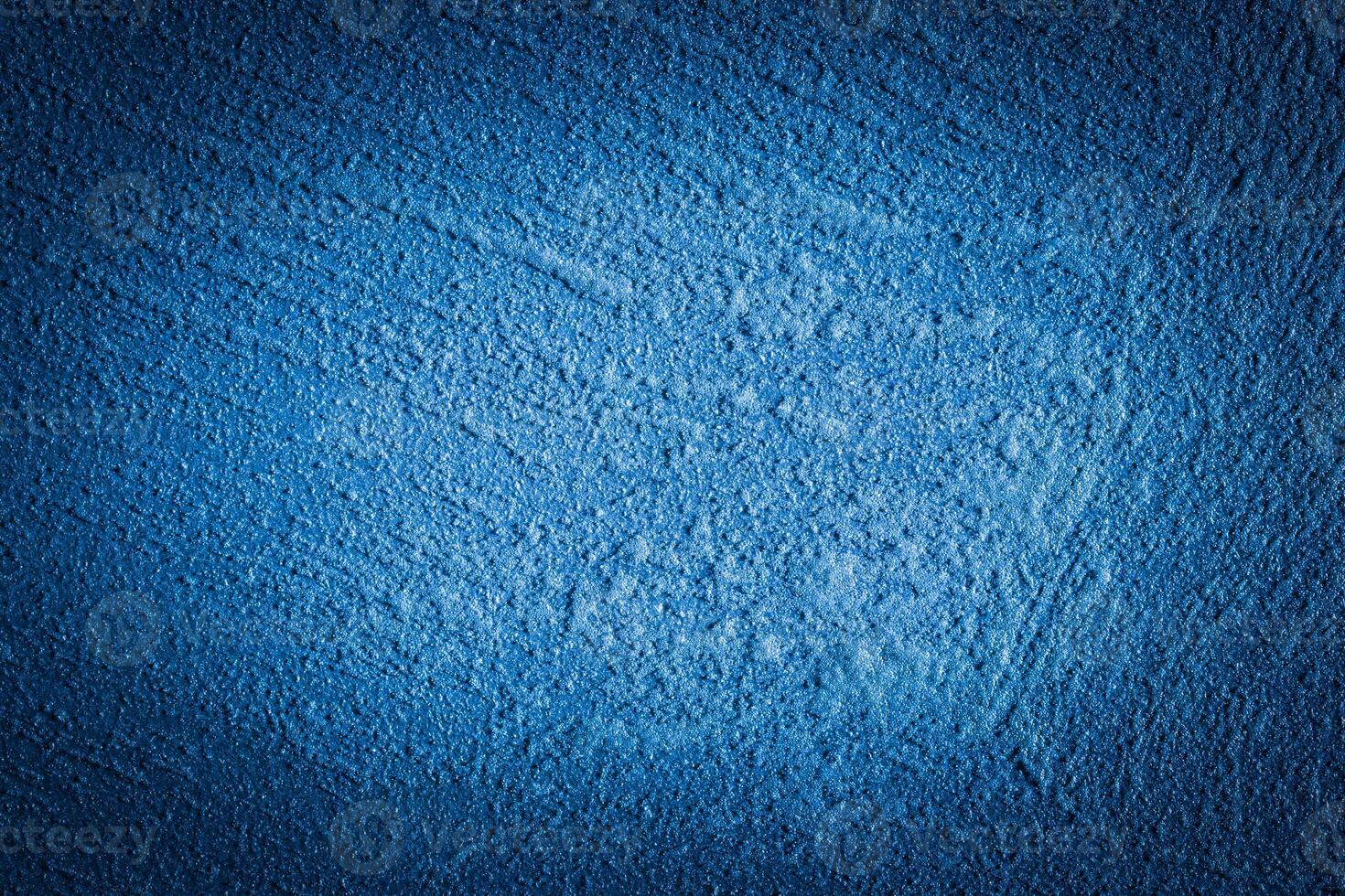 Blue decorative plaster texture with vignette. Abstract grunge background with copy space. photo