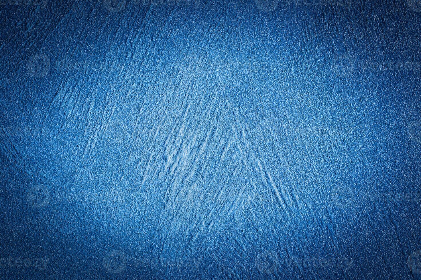 Blue decorative plaster texture with vignette. Abstract grunge background with copy space. photo
