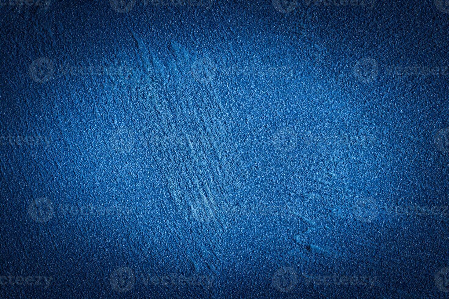 Blue decorative plaster texture with vignette. Abstract grunge background with copy space. photo