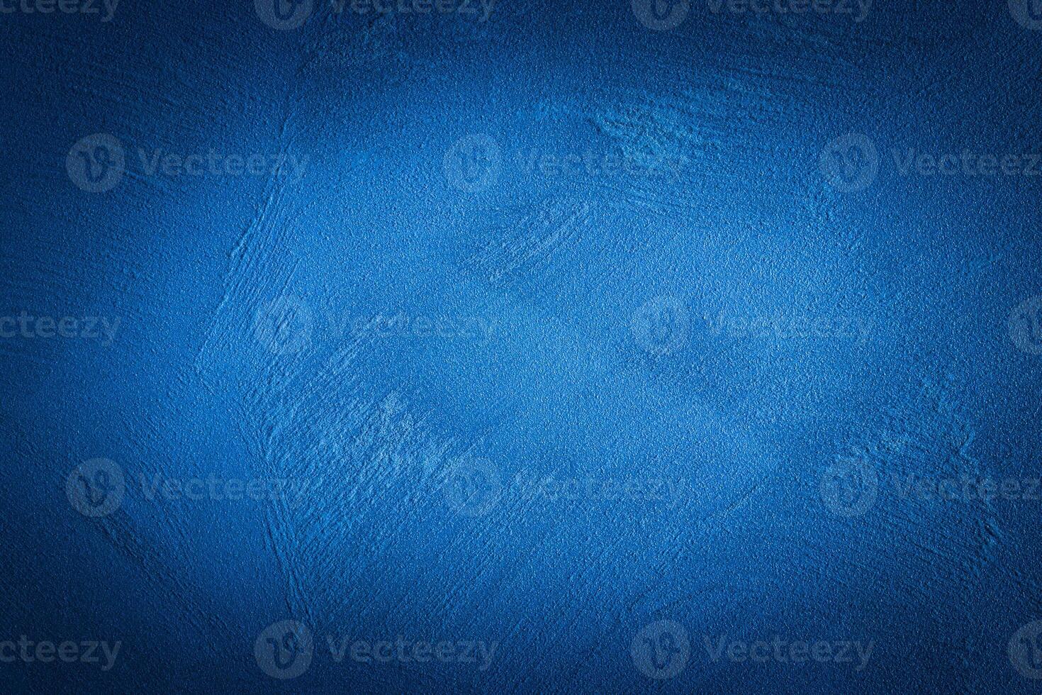 Blue decorative plaster texture with vignette. Abstract grunge background with copy space. photo
