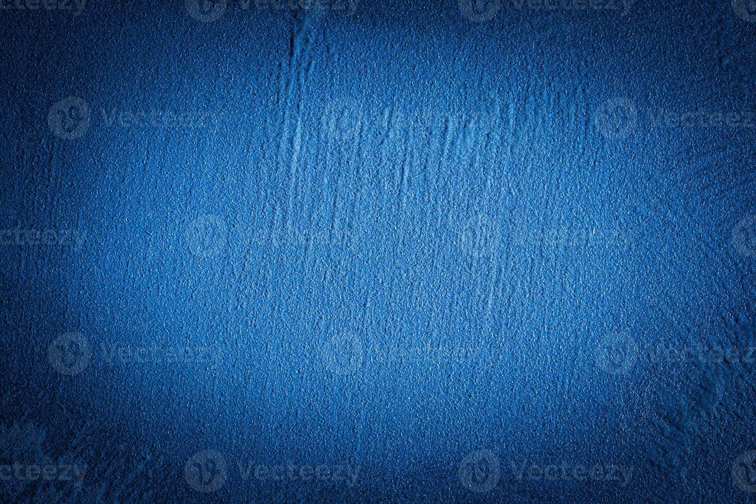Blue decorative plaster texture with vignette. Abstract grunge background with copy space. photo