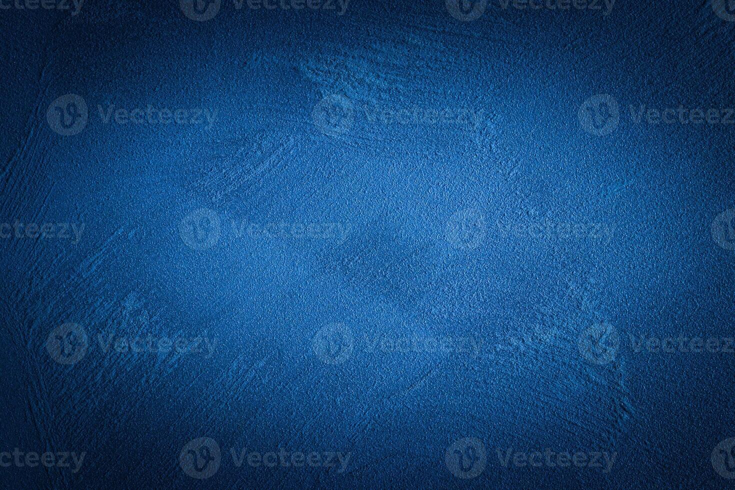 Blue decorative plaster texture with vignette. Abstract grunge background with copy space. photo
