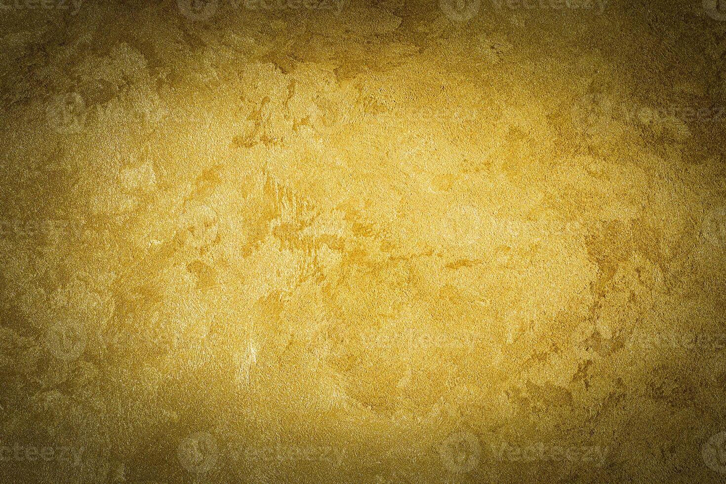 Golden decorative plaster texture with vignette. Abstract grunge background with copy space. photo