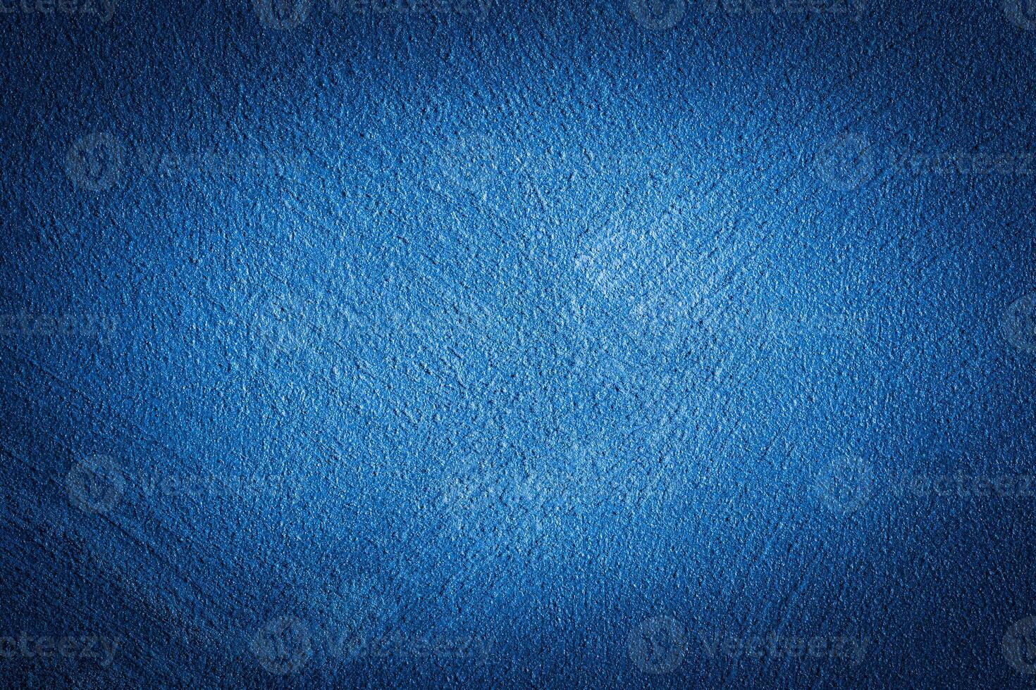 Blue decorative plaster texture with vignette. Abstract grunge background with copy space. photo