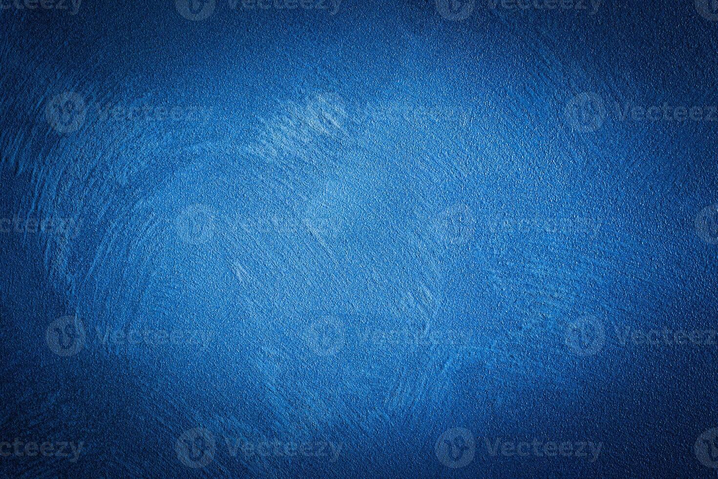 Blue decorative plaster texture with vignette. Abstract grunge background with copy space. photo