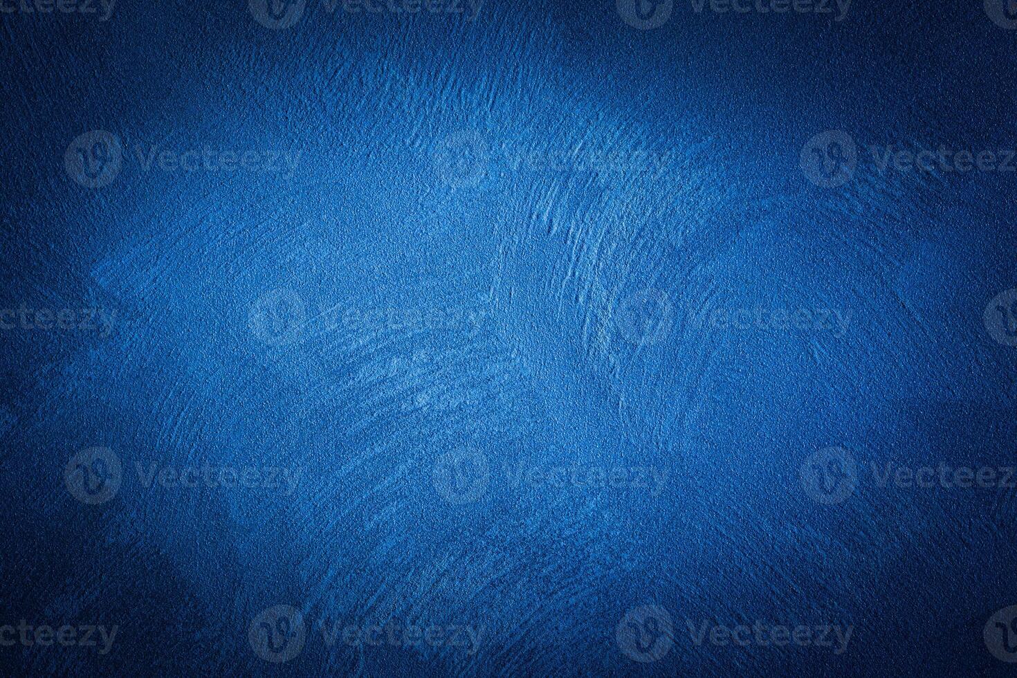 Blue decorative plaster texture with vignette. Abstract grunge background with copy space. photo