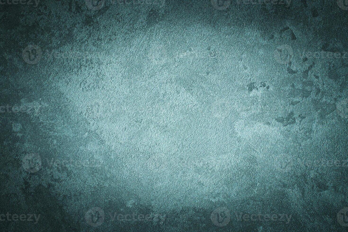 Cyan decorative plaster texture with vignette. Abstract grunge background with copy space. photo