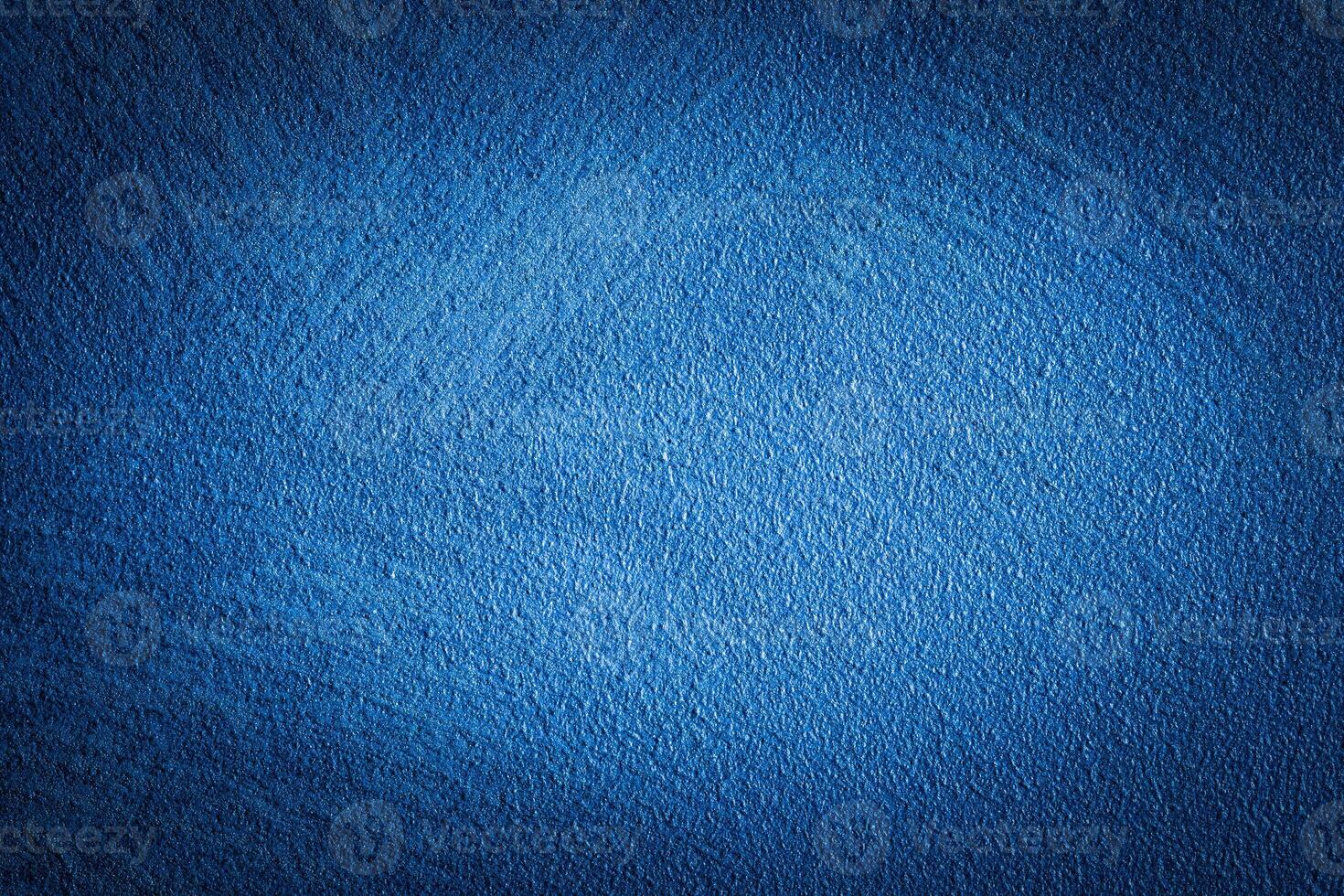 Blue decorative plaster texture with vignette. Abstract grunge background with copy space. photo
