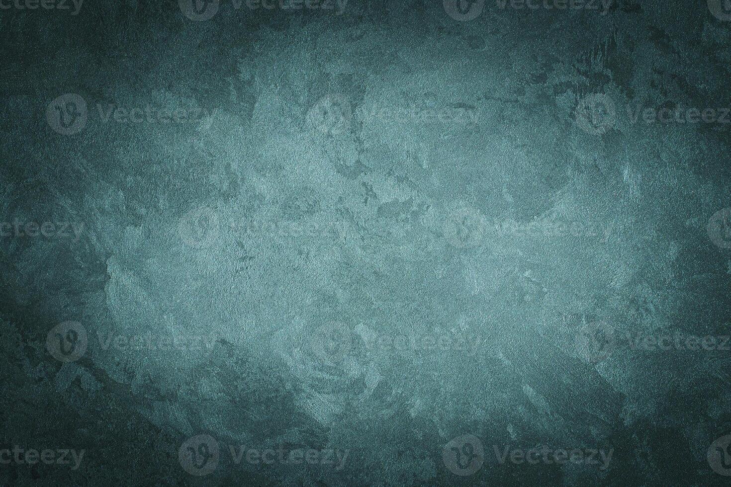 Cyan decorative plaster texture with vignette. Abstract grunge background with copy space. photo