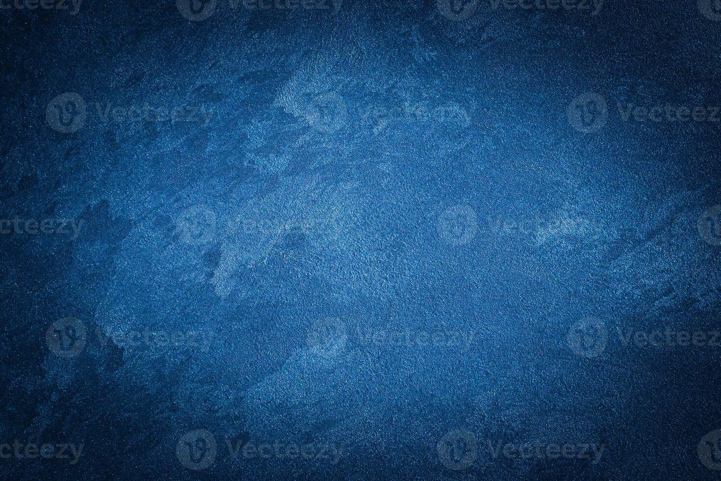 Blue decorative plaster texture with vignette. Abstract grunge background with copy space. photo