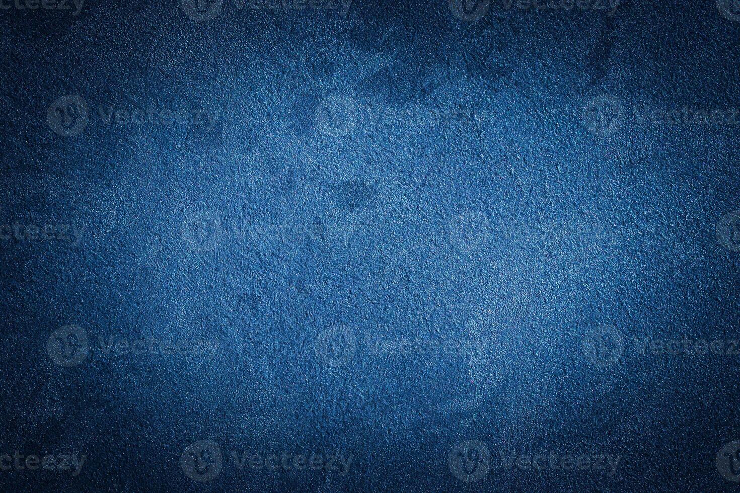 Blue decorative plaster texture with vignette. Abstract grunge background with copy space. photo