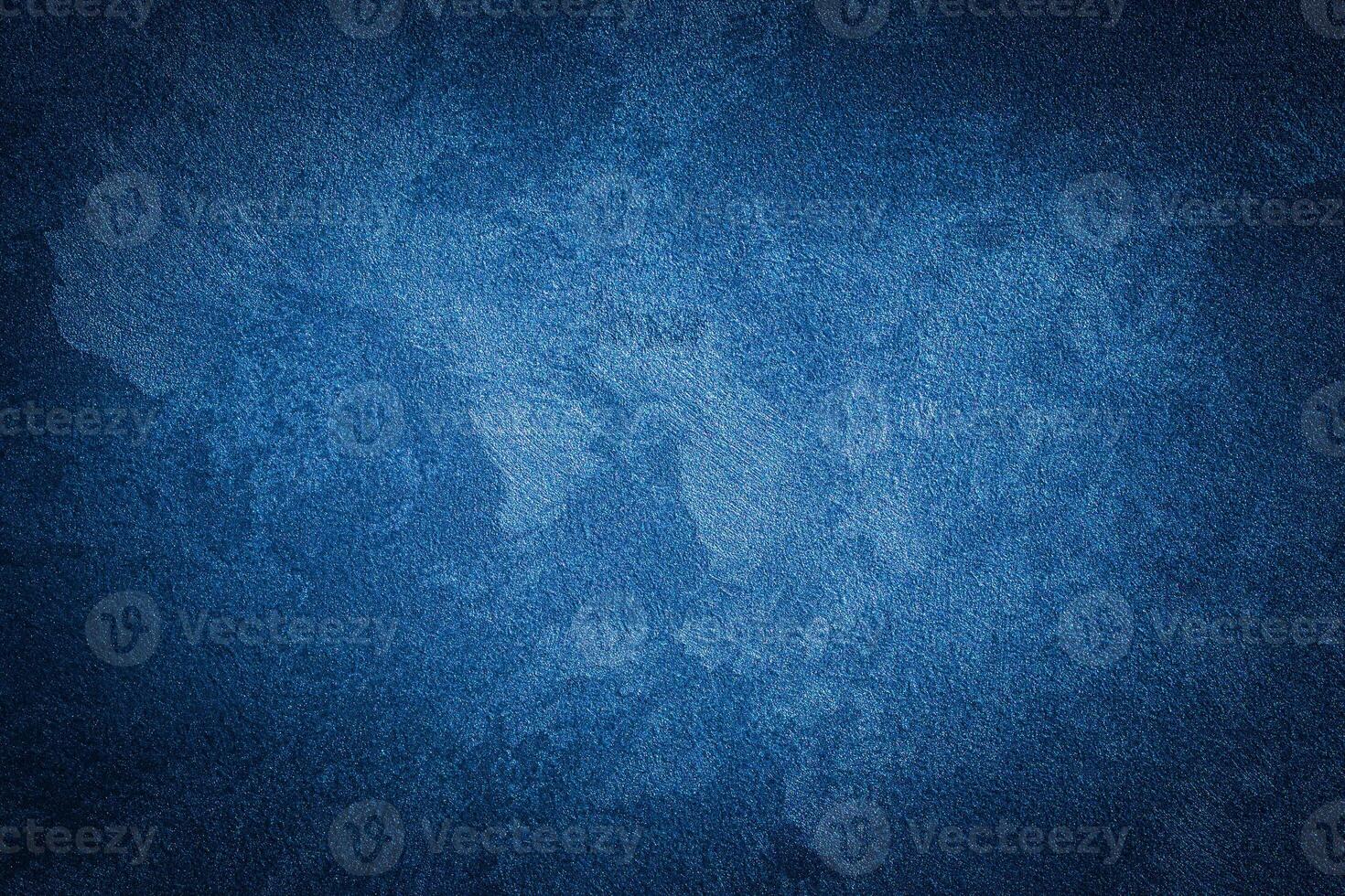 Blue decorative plaster texture with vignette. Abstract grunge background with copy space. photo