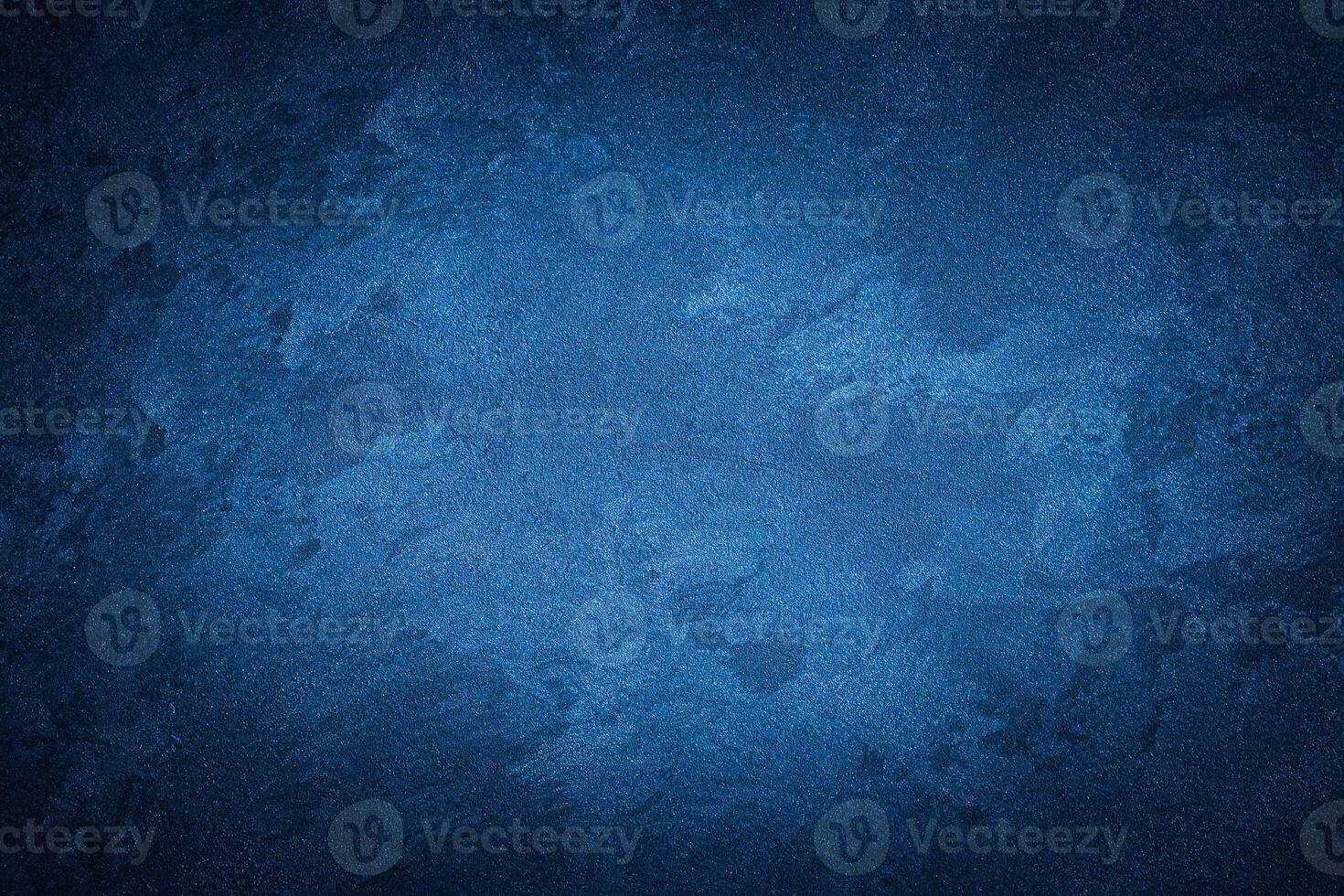 Blue decorative plaster texture with vignette. Abstract grunge background with copy space. photo
