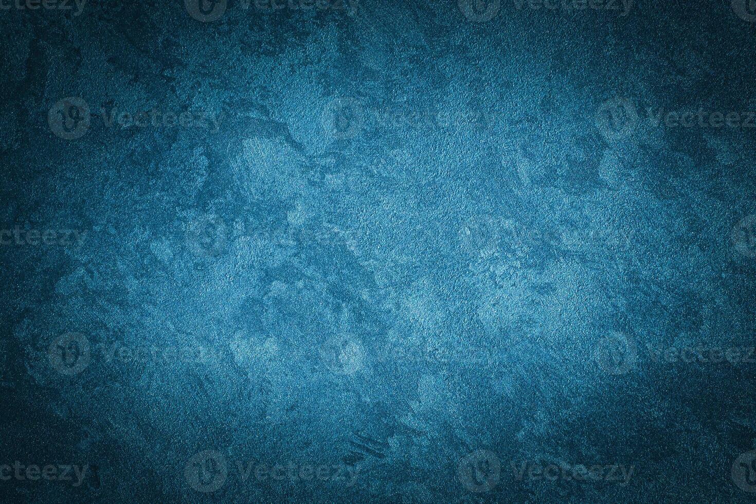 Cyan decorative plaster texture with vignette. Abstract grunge background with copy space. photo