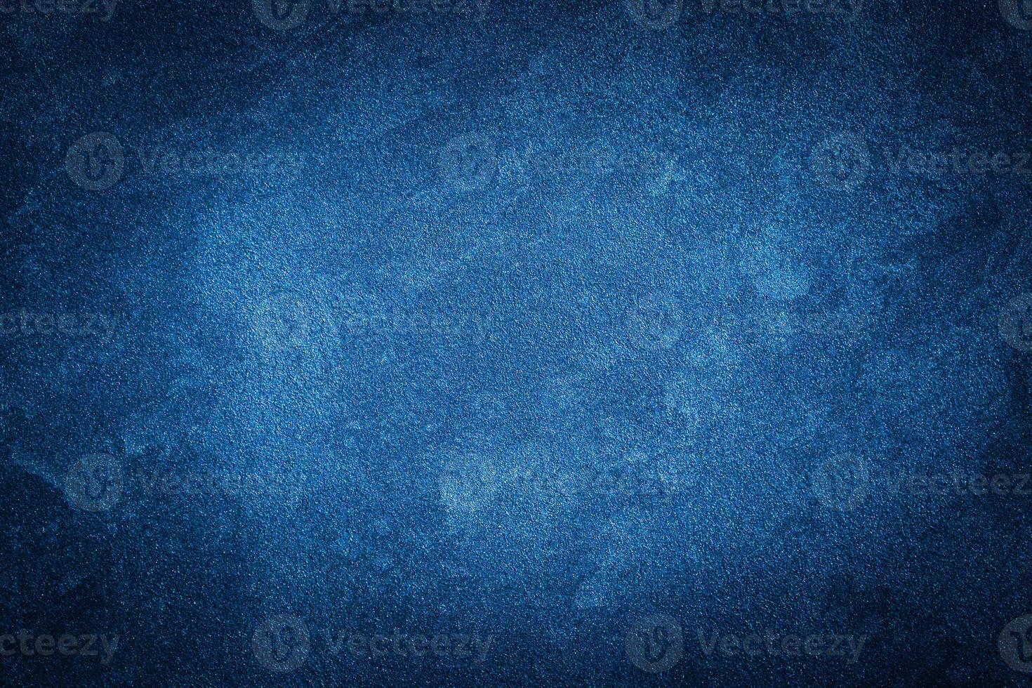 Blue decorative plaster texture with vignette. Abstract grunge background with copy space. photo