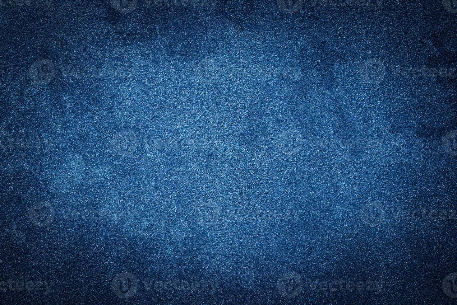 Blue decorative plaster texture with vignette. Abstract grunge background with copy space. photo