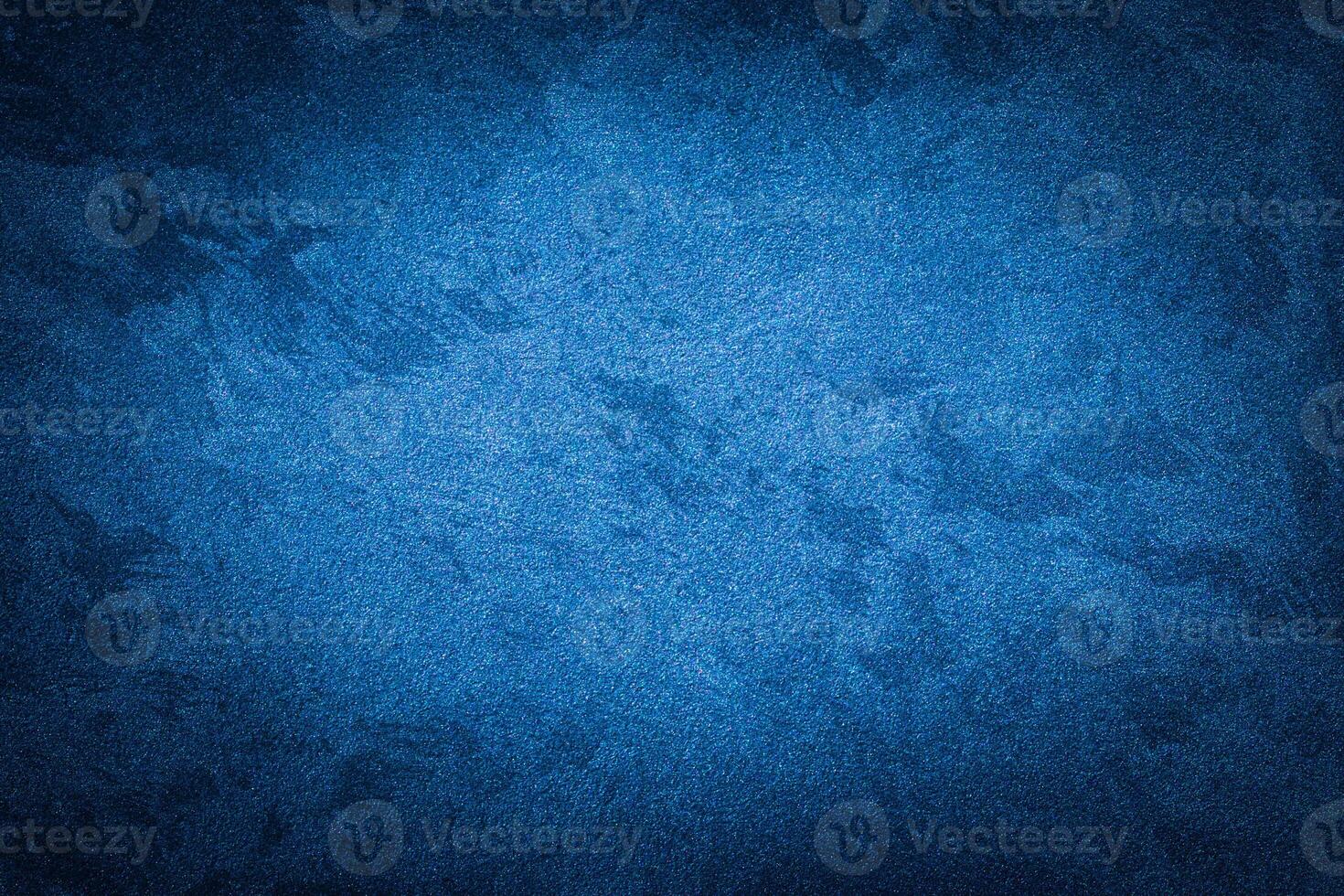 Blue decorative plaster texture with vignette. Abstract grunge background with copy space. photo