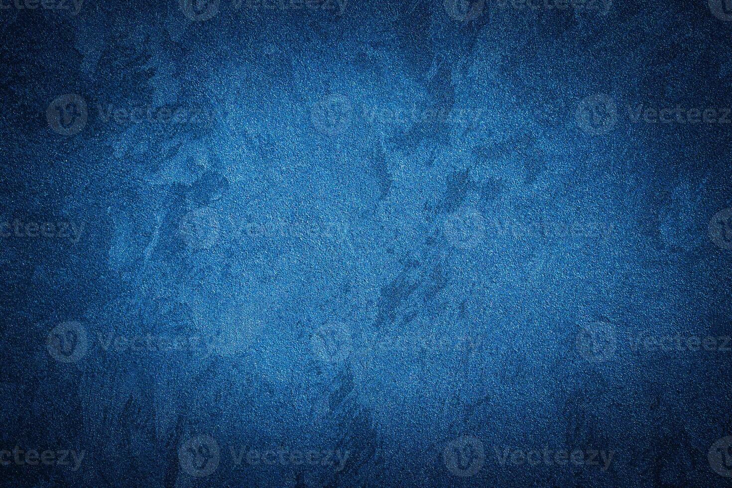 Blue decorative plaster texture with vignette. Abstract grunge background with copy space. photo