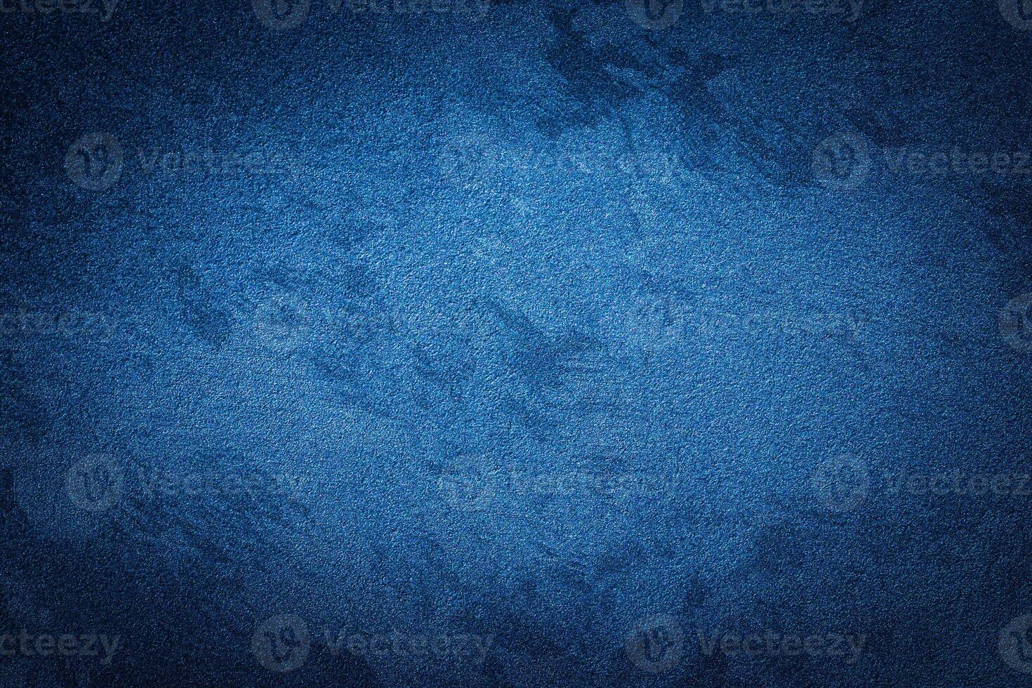 Blue decorative plaster texture with vignette. Abstract grunge background with copy space. photo