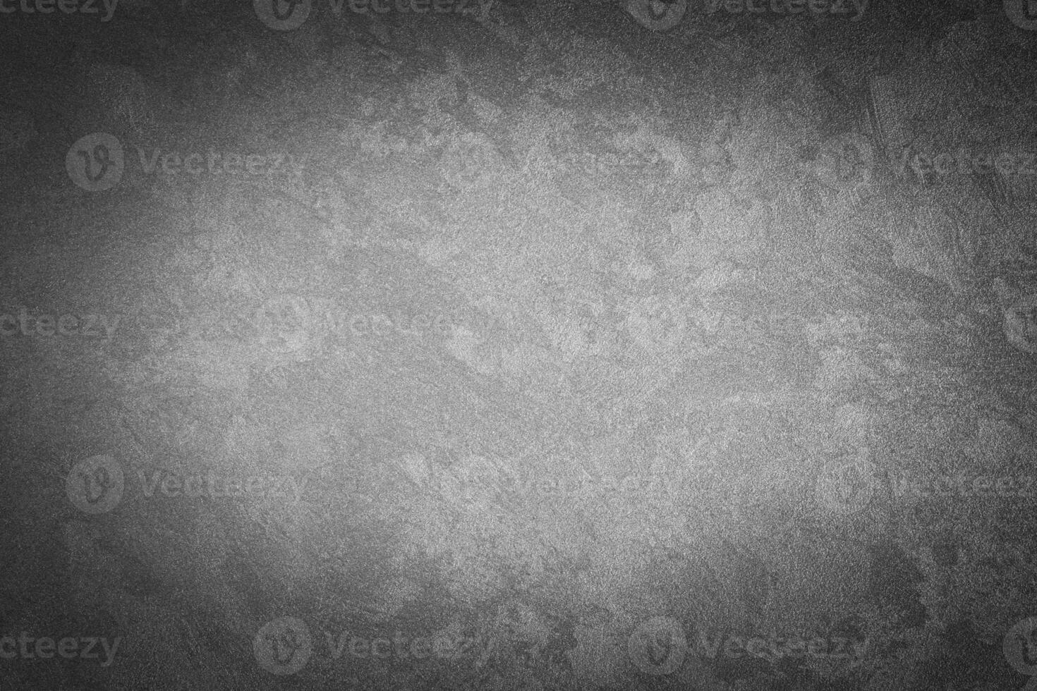 Gray decorative plaster texture with vignette. Abstract grunge background with copy space. photo
