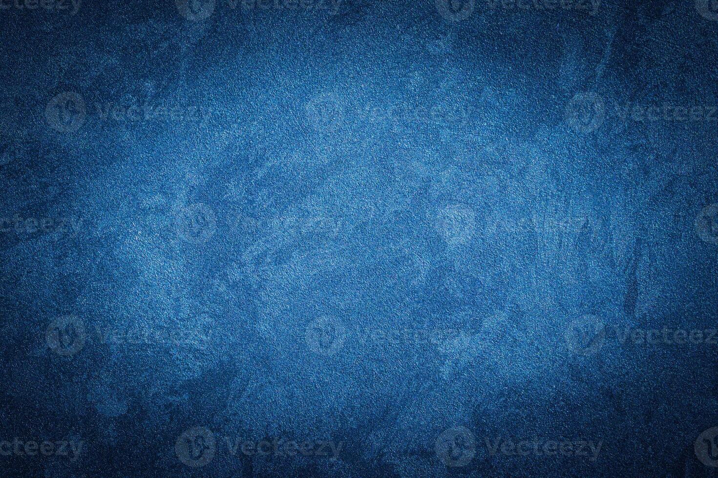 Blue decorative plaster texture with vignette. Abstract grunge background with copy space. photo