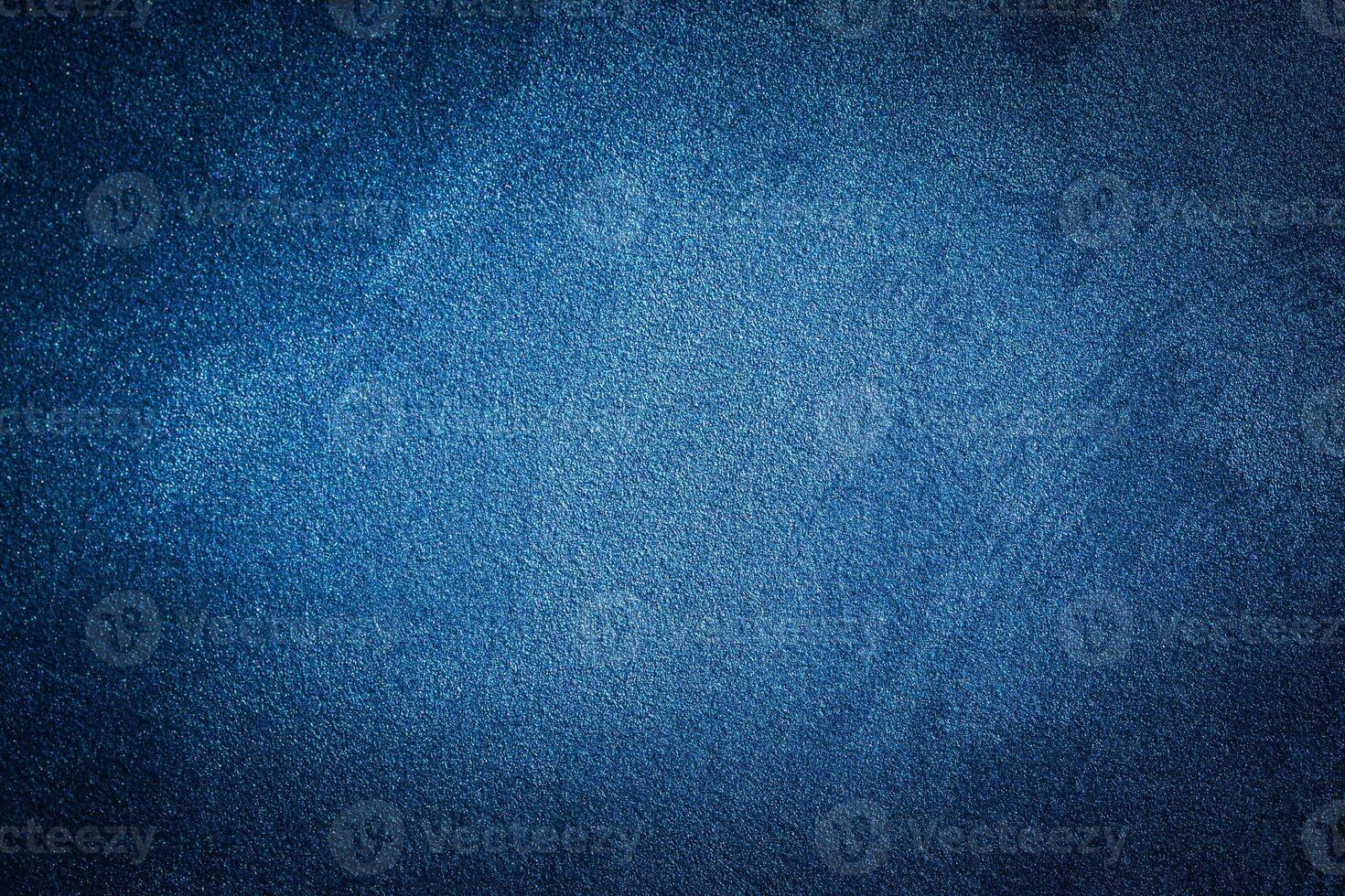 Blue decorative plaster texture with vignette. Abstract grunge background with copy space. photo