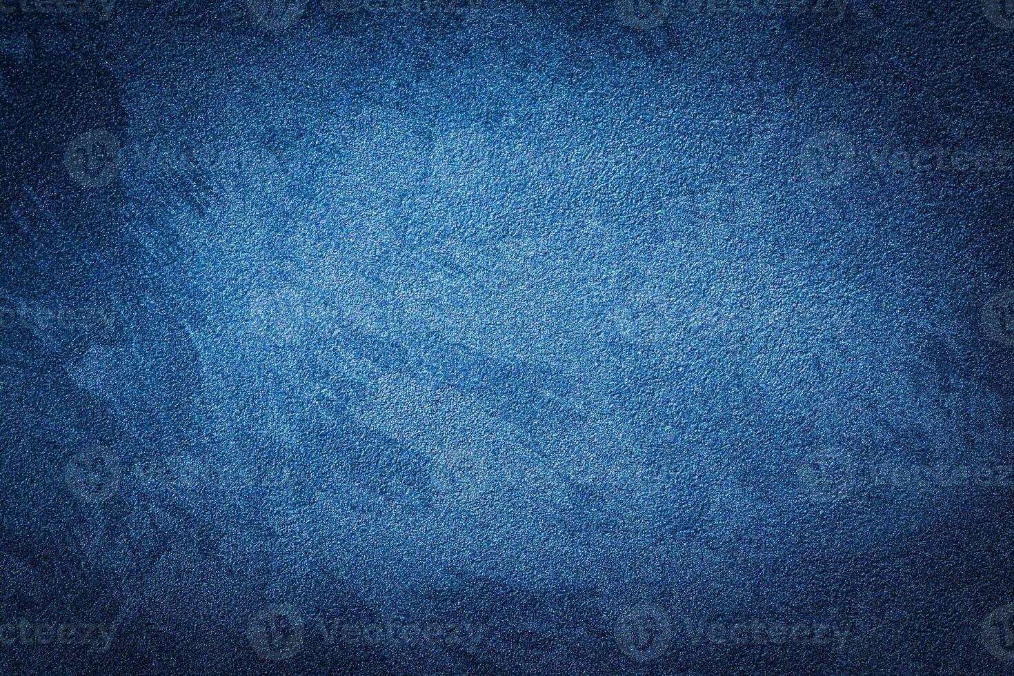 Blue decorative plaster texture with vignette. Abstract grunge background with copy space. photo
