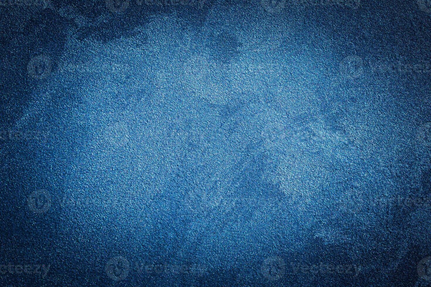 Blue decorative plaster texture with vignette. Abstract grunge background with copy space. photo