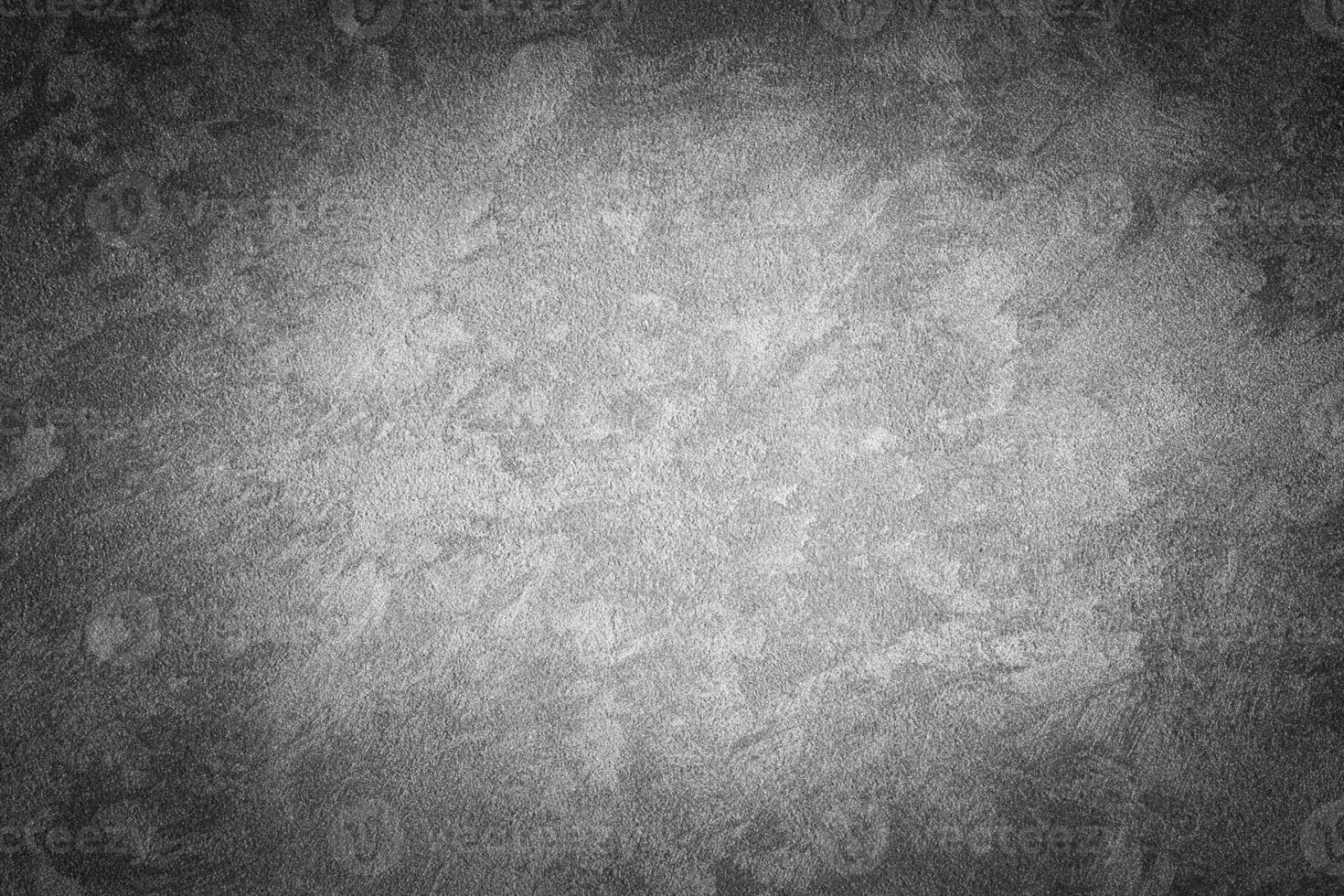 Gray decorative plaster texture with vignette. Abstract grunge background with copy space. photo