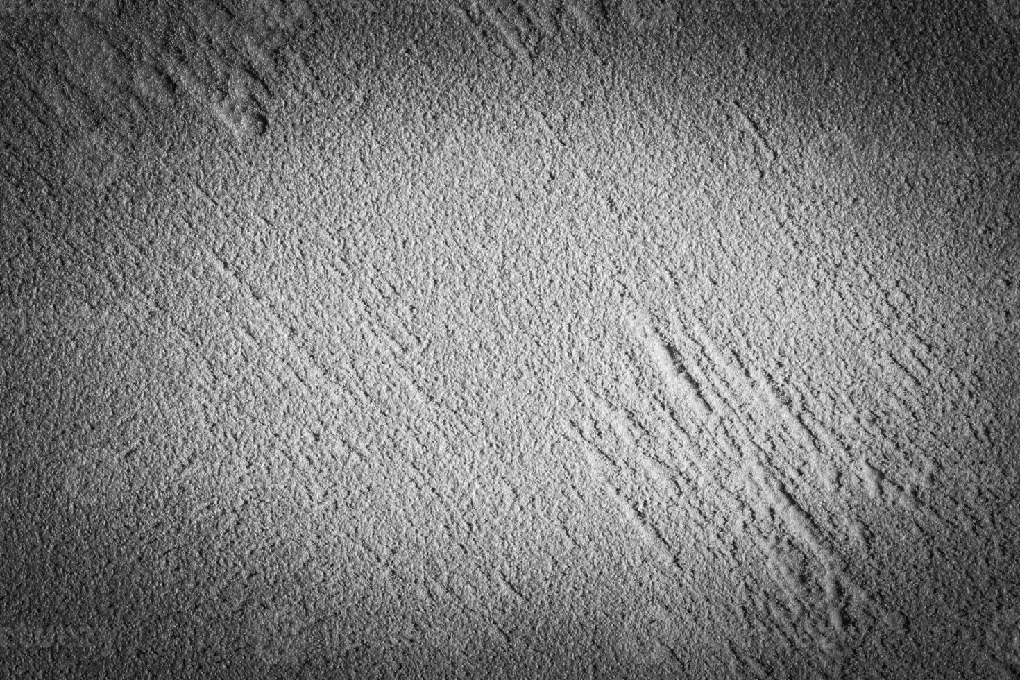 Gray decorative plaster texture with vignette. Abstract grunge background with copy space. photo