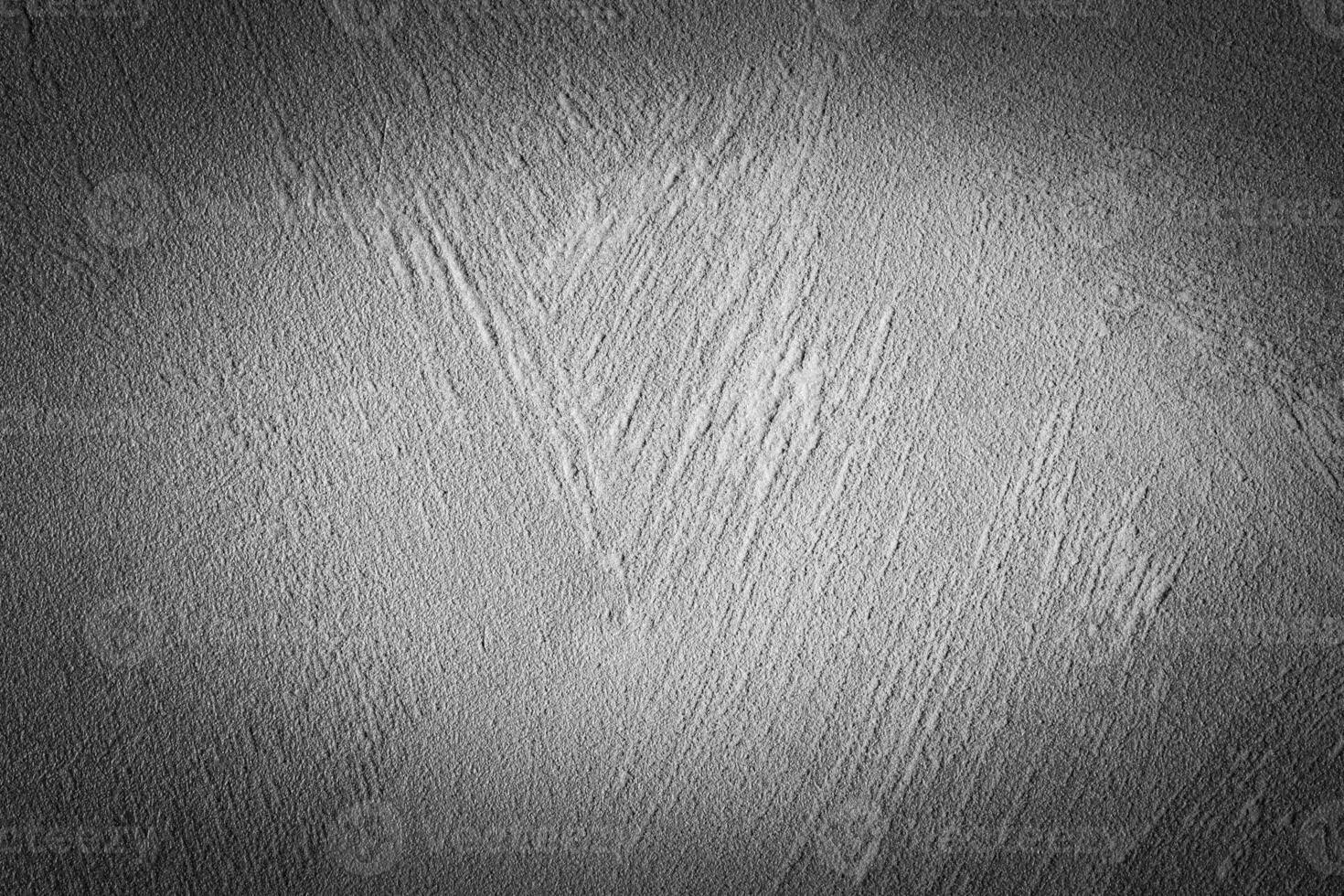 Gray decorative plaster texture with vignette. Abstract grunge background with copy space. photo