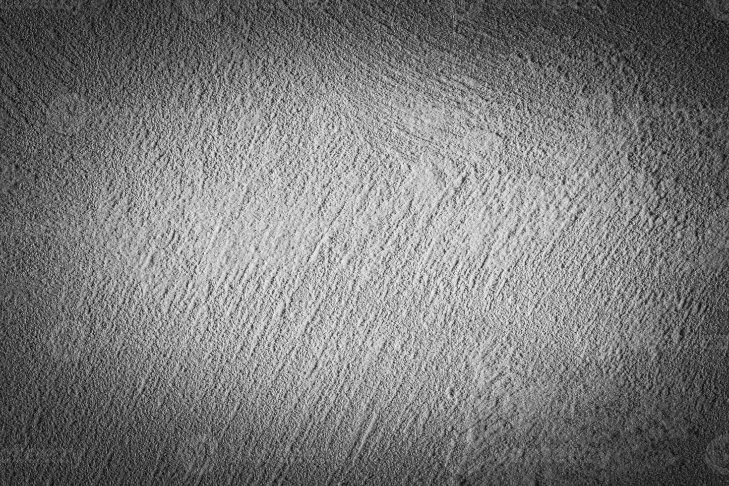 Gray decorative plaster texture with vignette. Abstract grunge background with copy space. photo