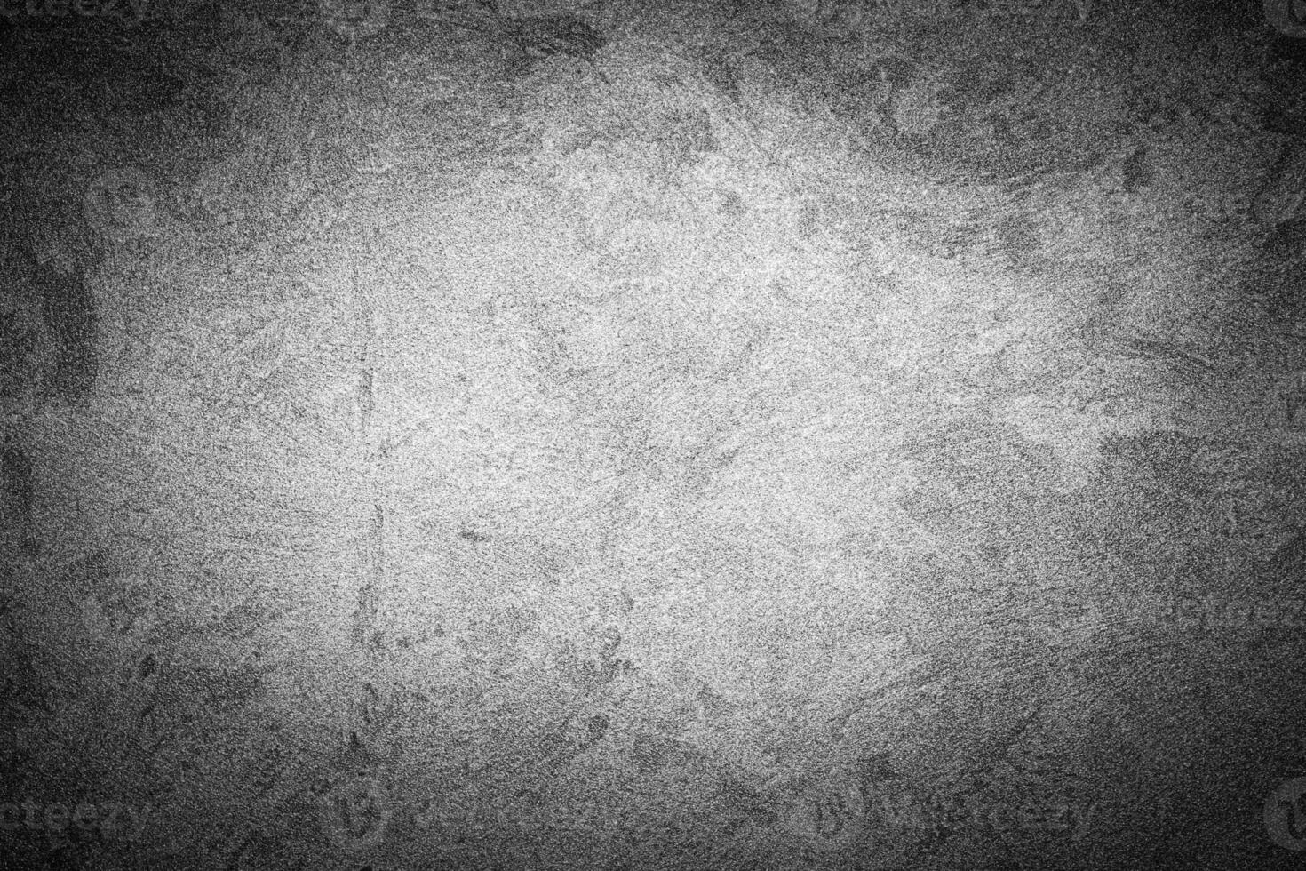 Gray decorative plaster texture with vignette. Abstract grunge background with copy space. photo