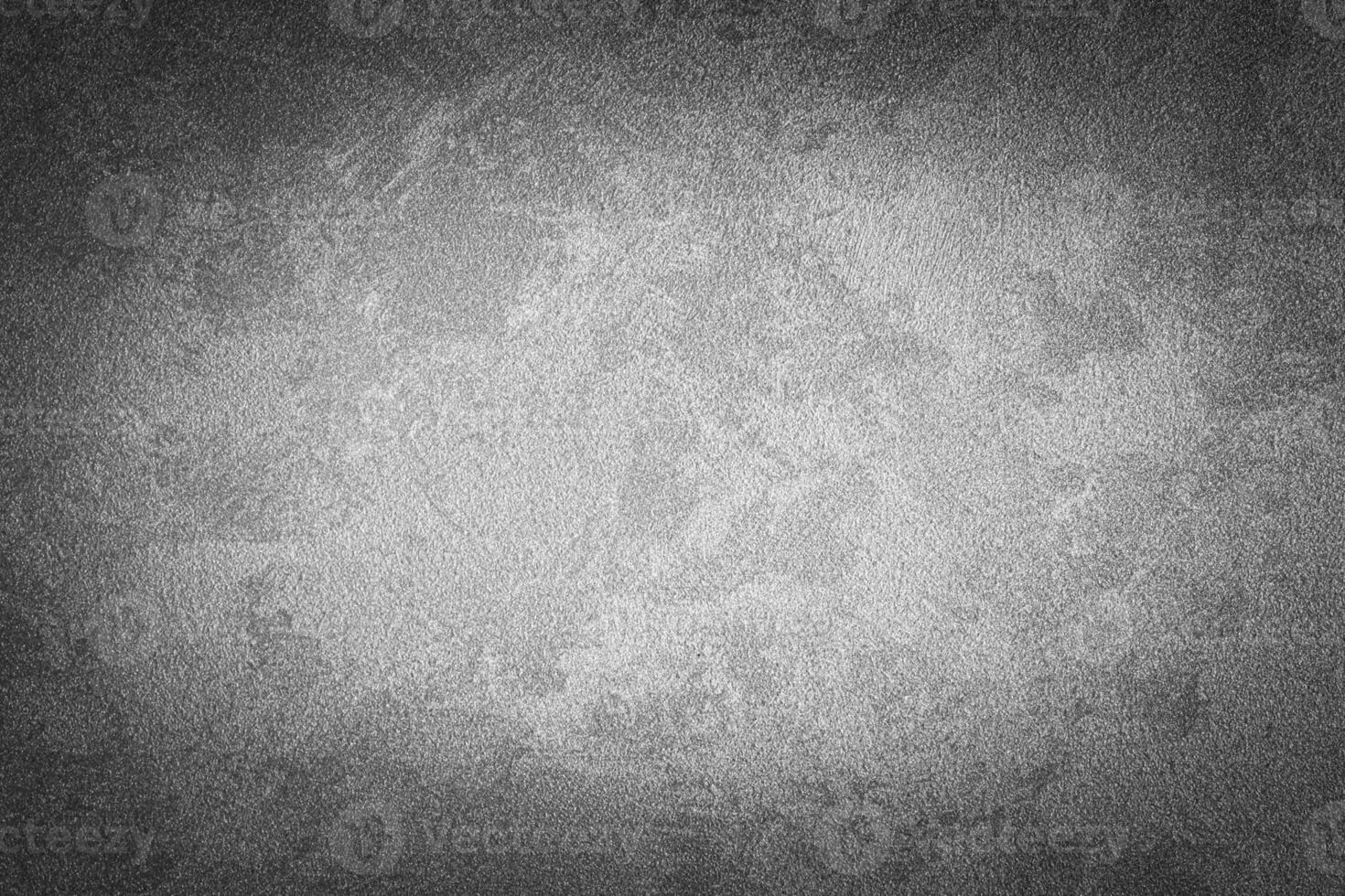 Gray decorative plaster texture with vignette. Abstract grunge background with copy space. photo