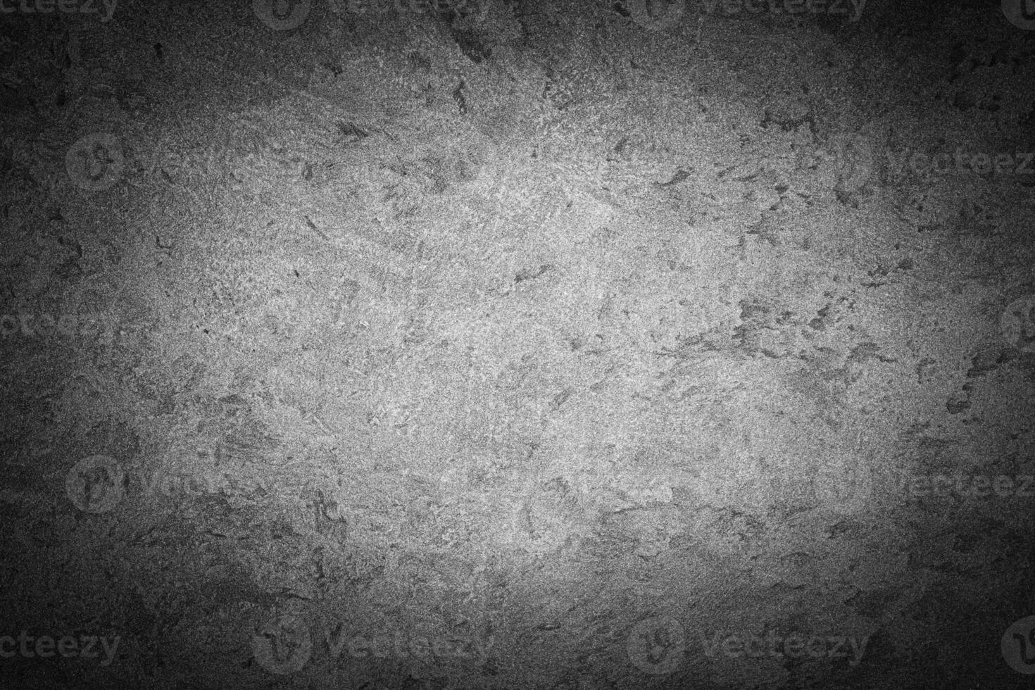 Gray decorative plaster texture with vignette. Abstract grunge background with copy space. photo